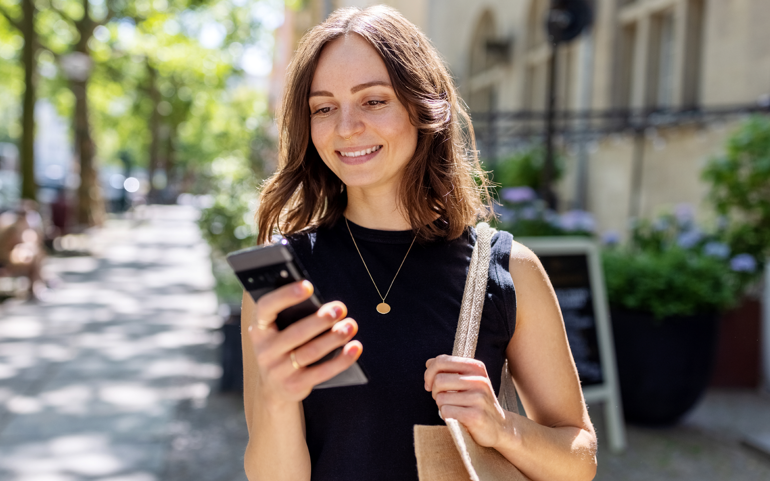Image of woman looking at phone