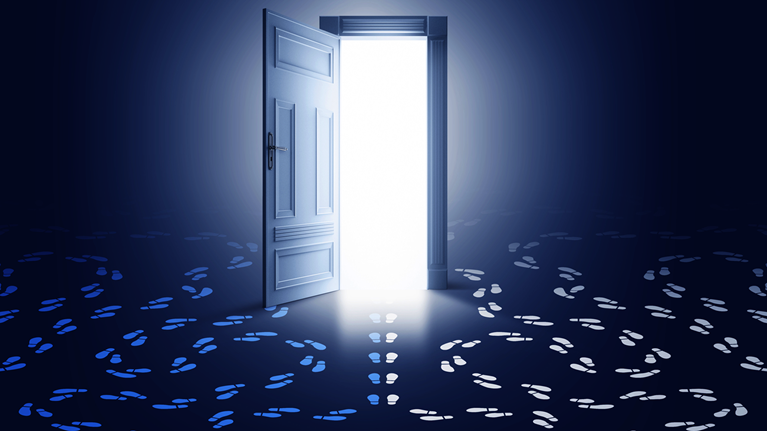 A glowing, open doorway with two sets of footprints with circling paths at either side and a third set of footprints heading through the door.