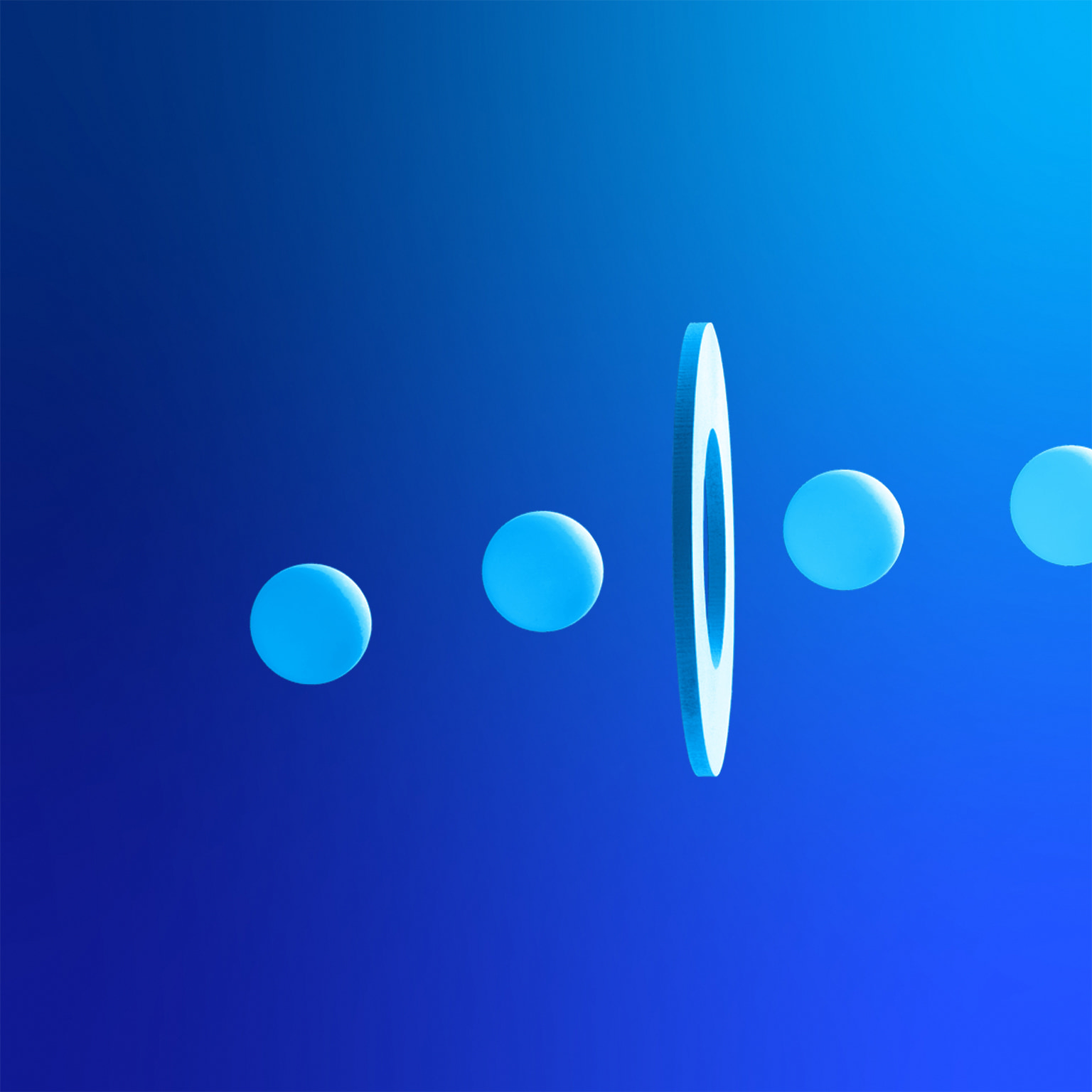 Line of balls going through a hole on floating white disc