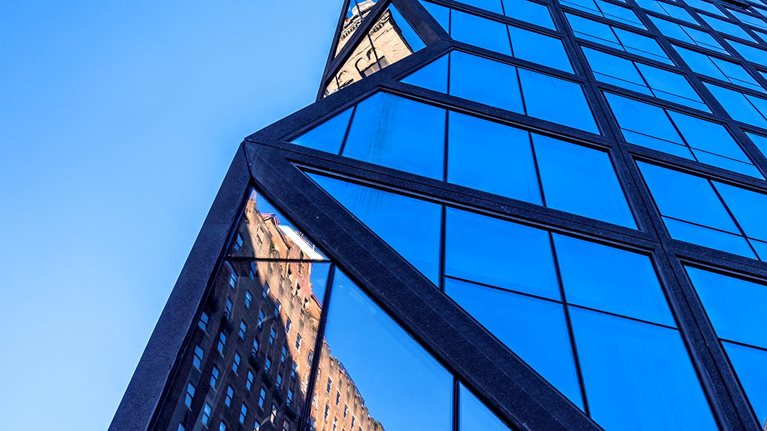 Looking up at a hig-hrise residential tower