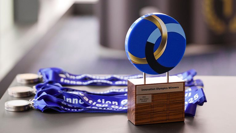 medals and trophy displayed on a table top