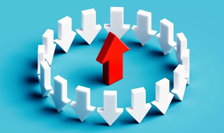 A striking conceptual illustration showing a circle of white arrows all pointing downward, contrasted by a bold red arrow in the center pointing upward.