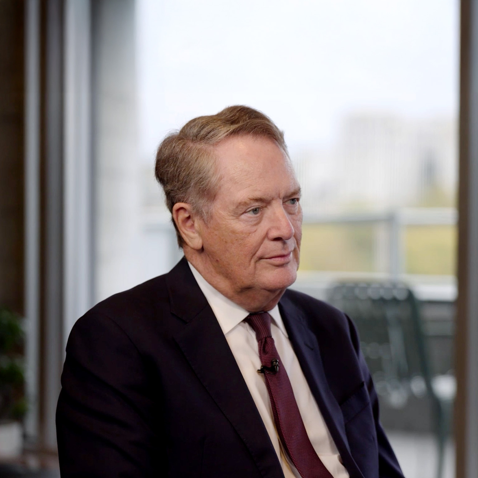 Robert Lighthizer in a suit and tie, seated and looking slightly to his right with a composed, attentive expression.