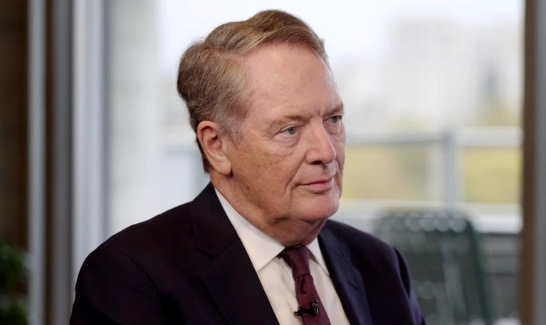 Robert Lighthizer in a suit and tie, seated and looking slightly to his right with a composed, attentive expression.