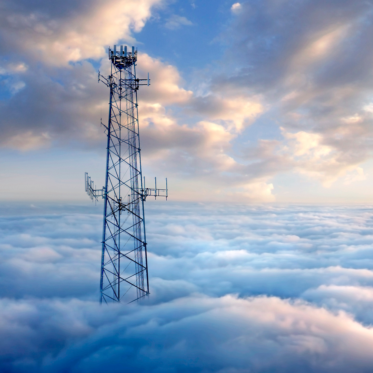 Cellular tower above clouds