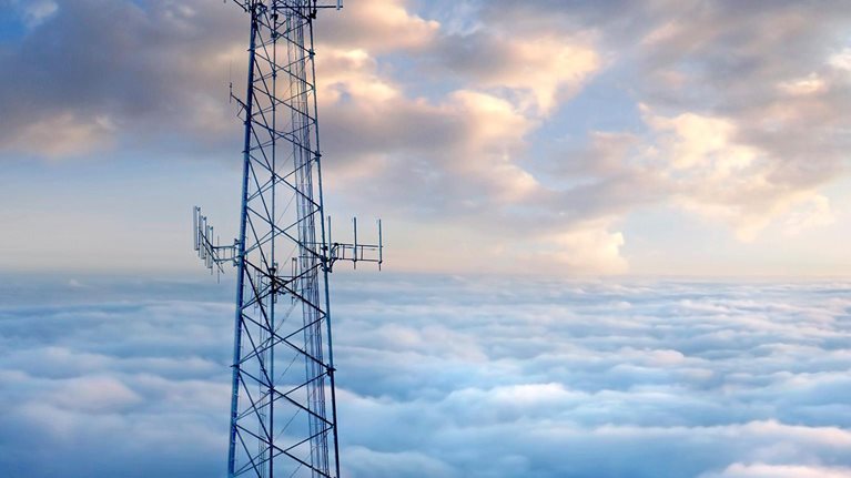 Cellular tower above clouds