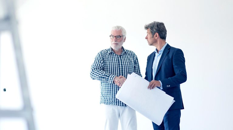 Business people in an office space that is getting remodeled.