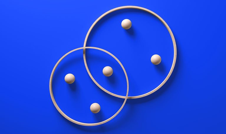 Interlocking contemporary wooden rings with embedded spheres, symbolizing a harmonious partnership, set against a vibrant blue background.