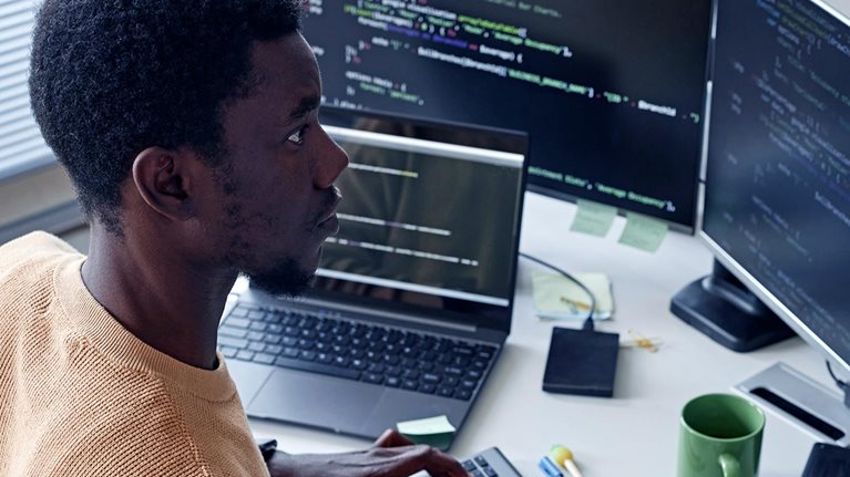 Developer working with security codes on computer