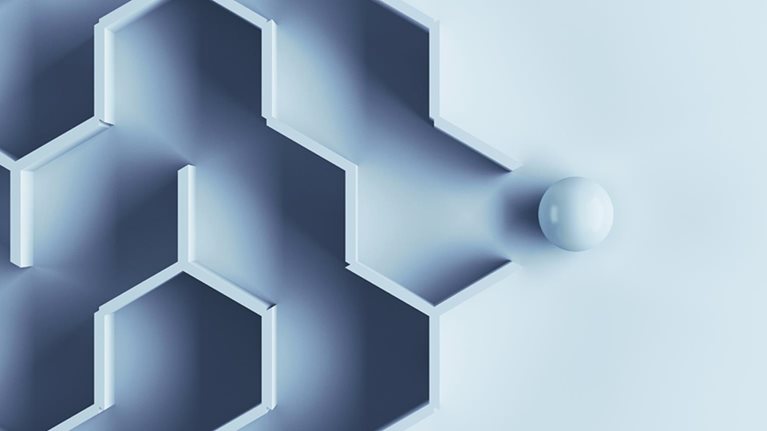 Hexagonal labyrinth with single ball escaping the maze.