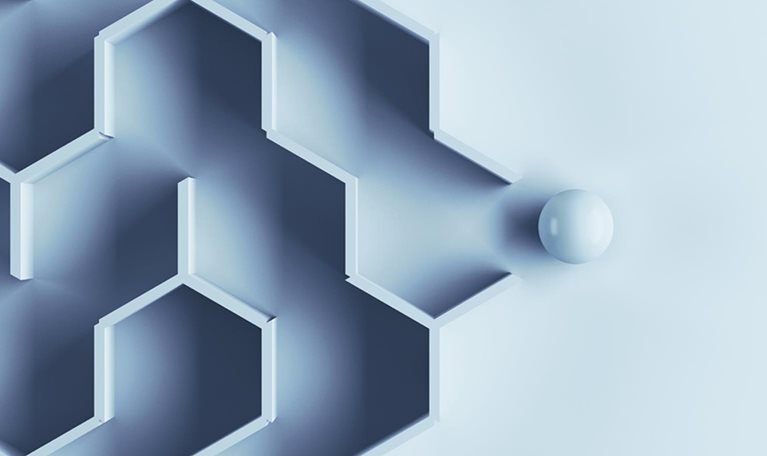 Hexagonal labyrinth with single ball escaping the maze.