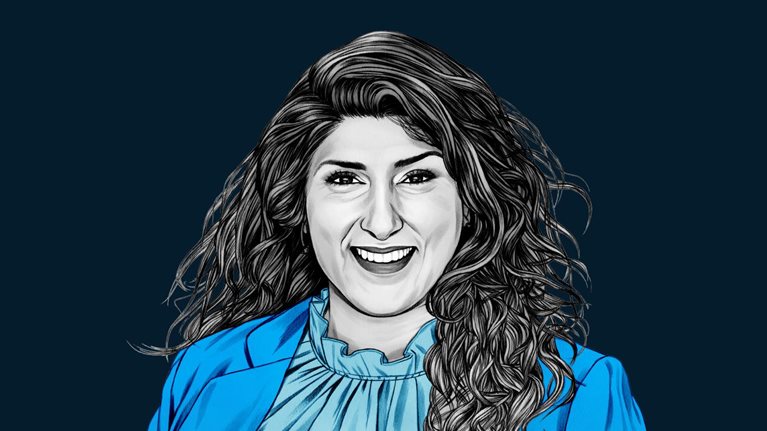 A hand-drawn illustration of Navrina Singh, smiling and wearing a ruffle collared blouse and suit jacket. The drawing features precise lines and subtle shading, using black and white tones for her face and blues for her attire.
