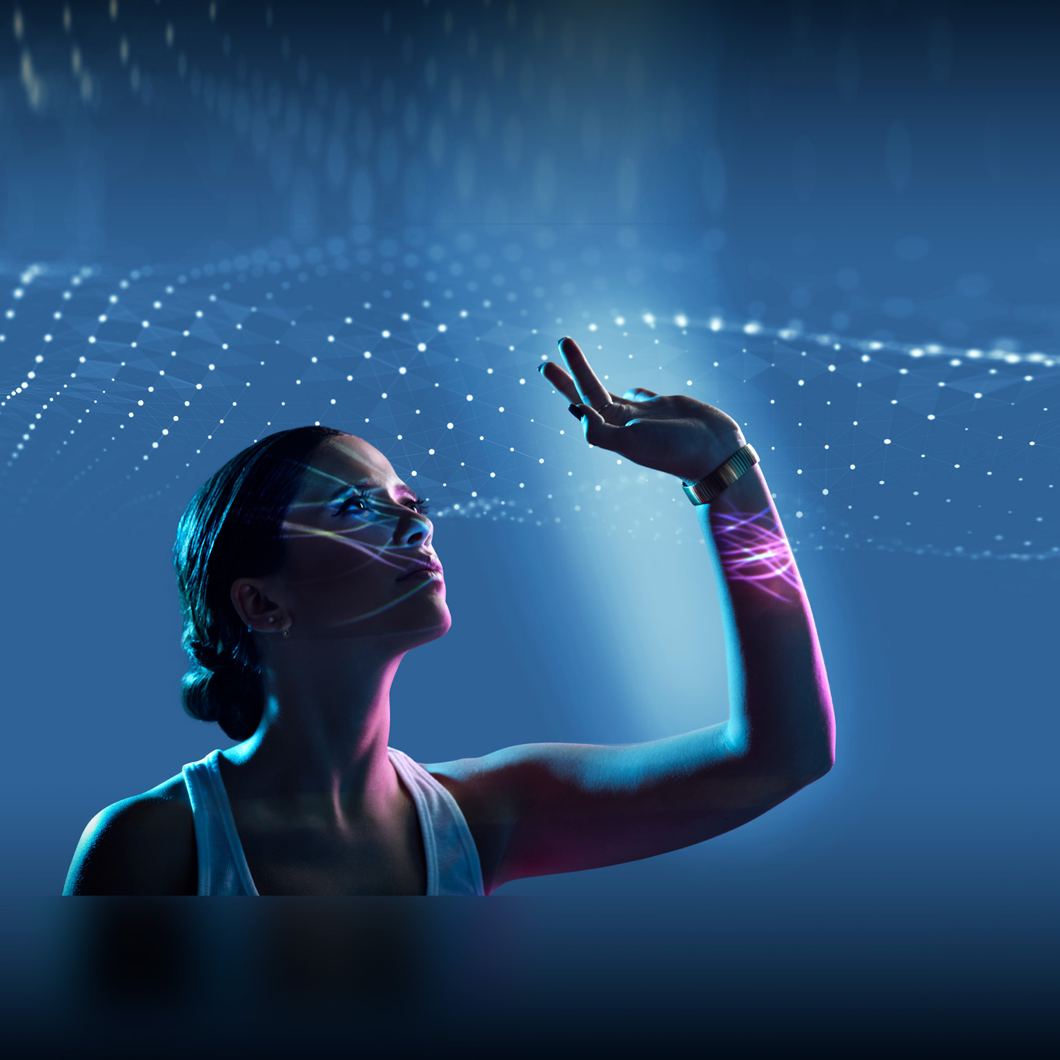 Caucasian woman with high technology effects on and around her - stock photo