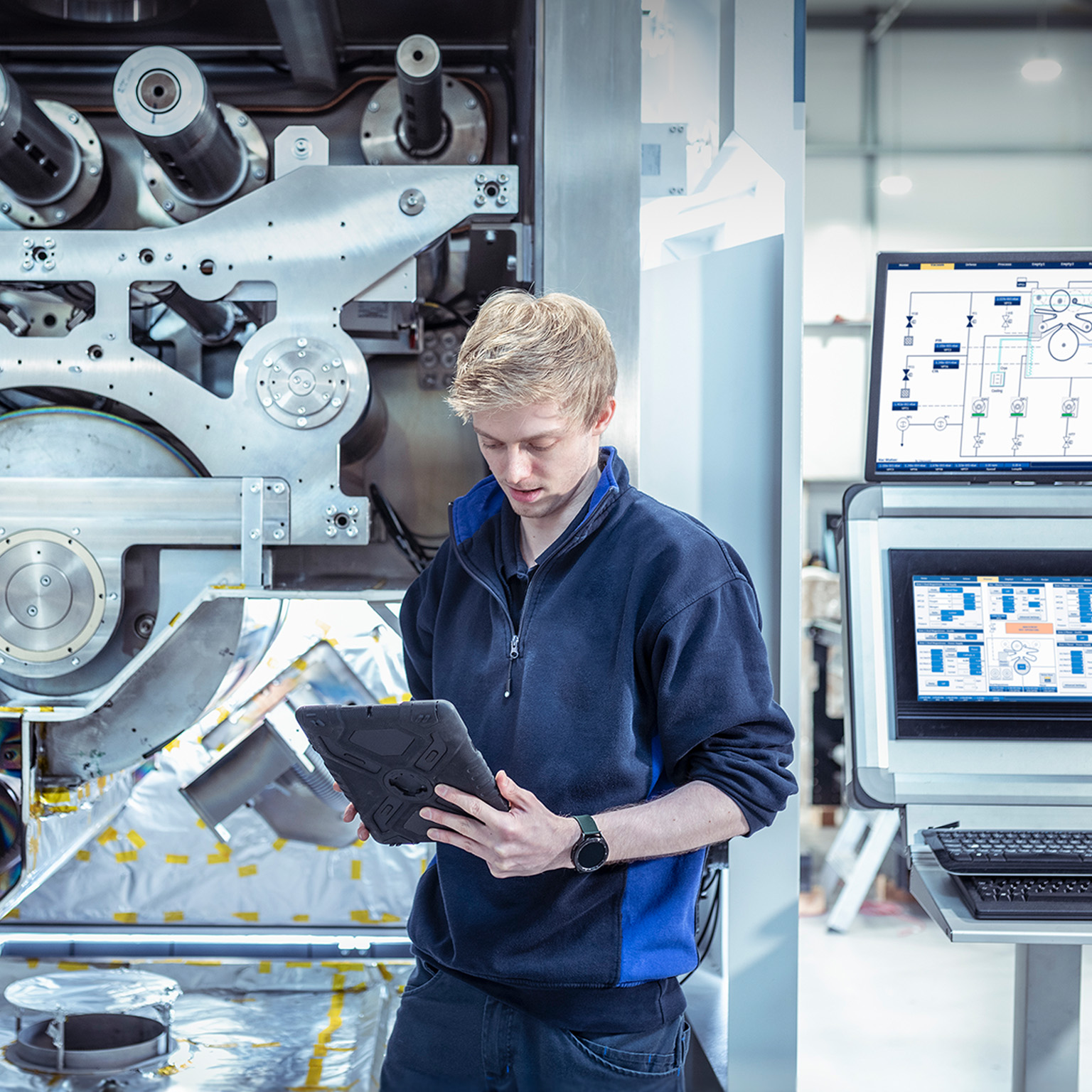 Designer engineer with vacuum coating machine for automotive battery use