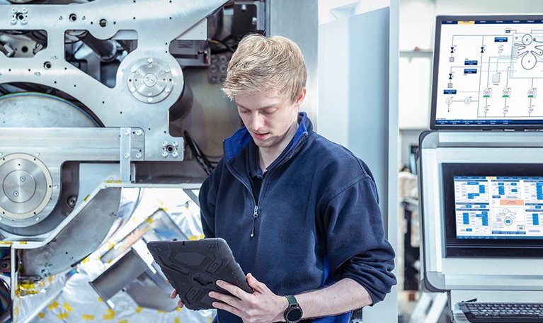 Designer engineer with vacuum coating machine for automotive battery use