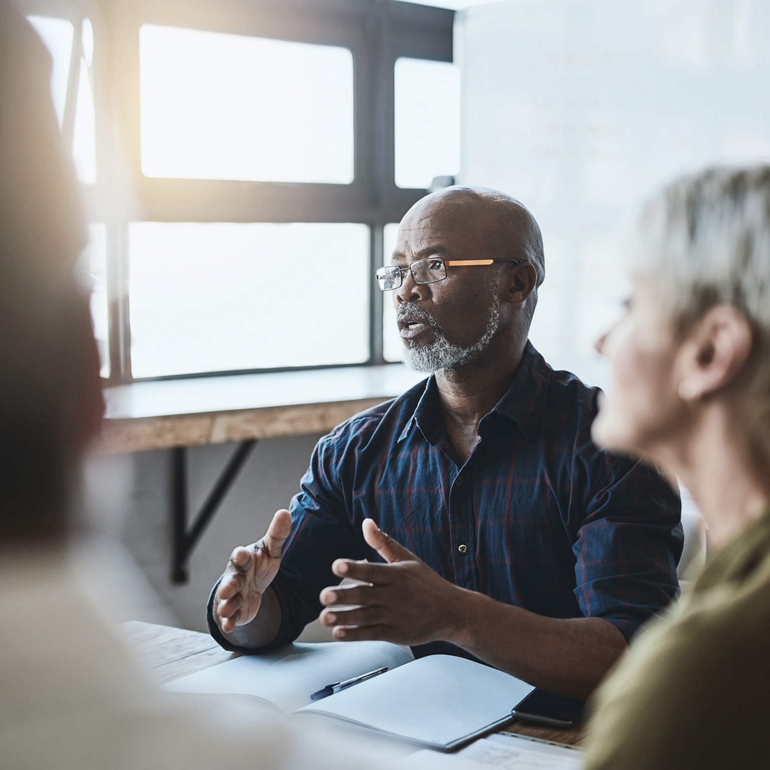 Business people at table working together.