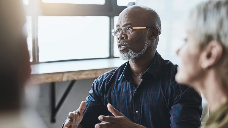 Business people at table working together.