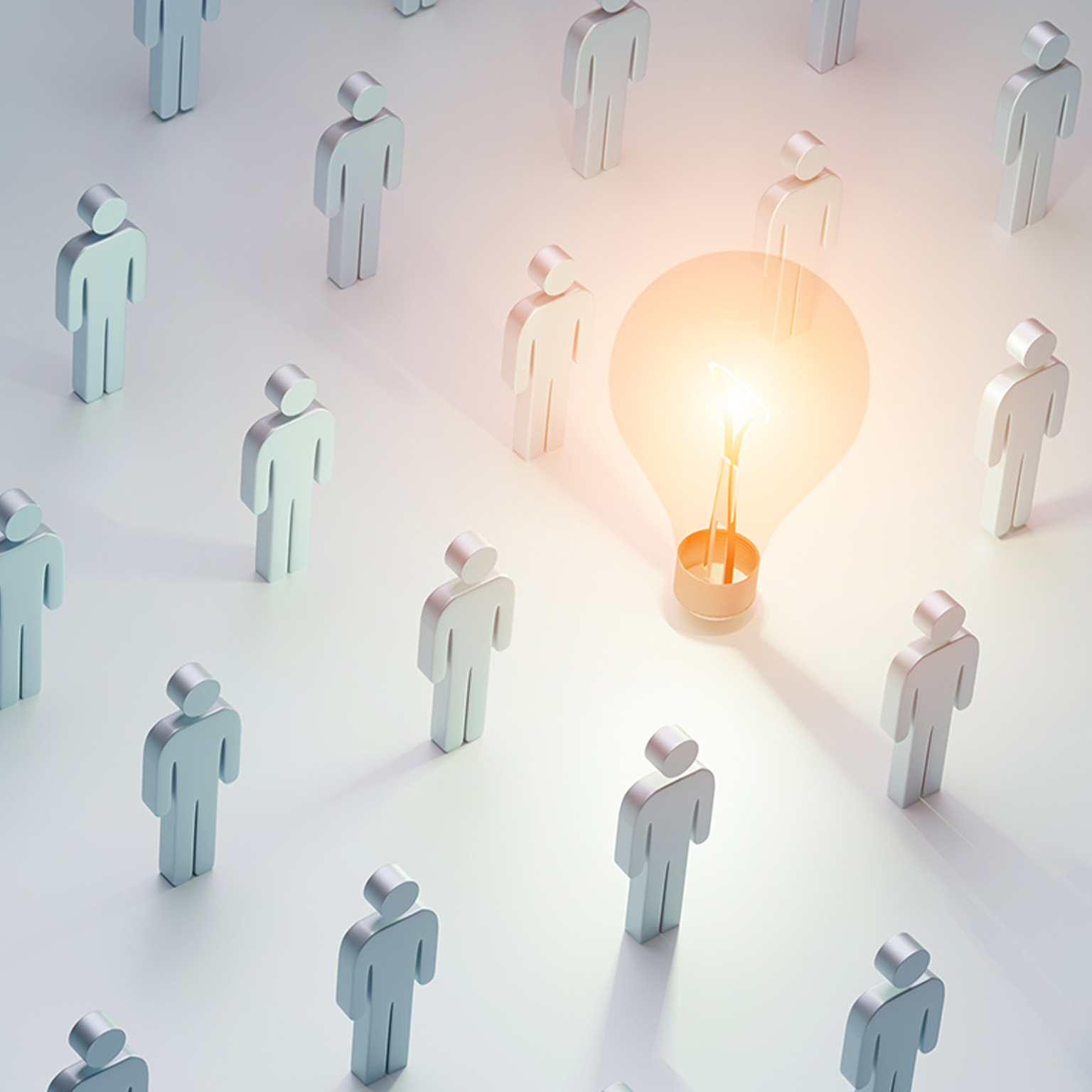 Concept of ideas. Masses of icon people standing around light bulb glowing brightly.