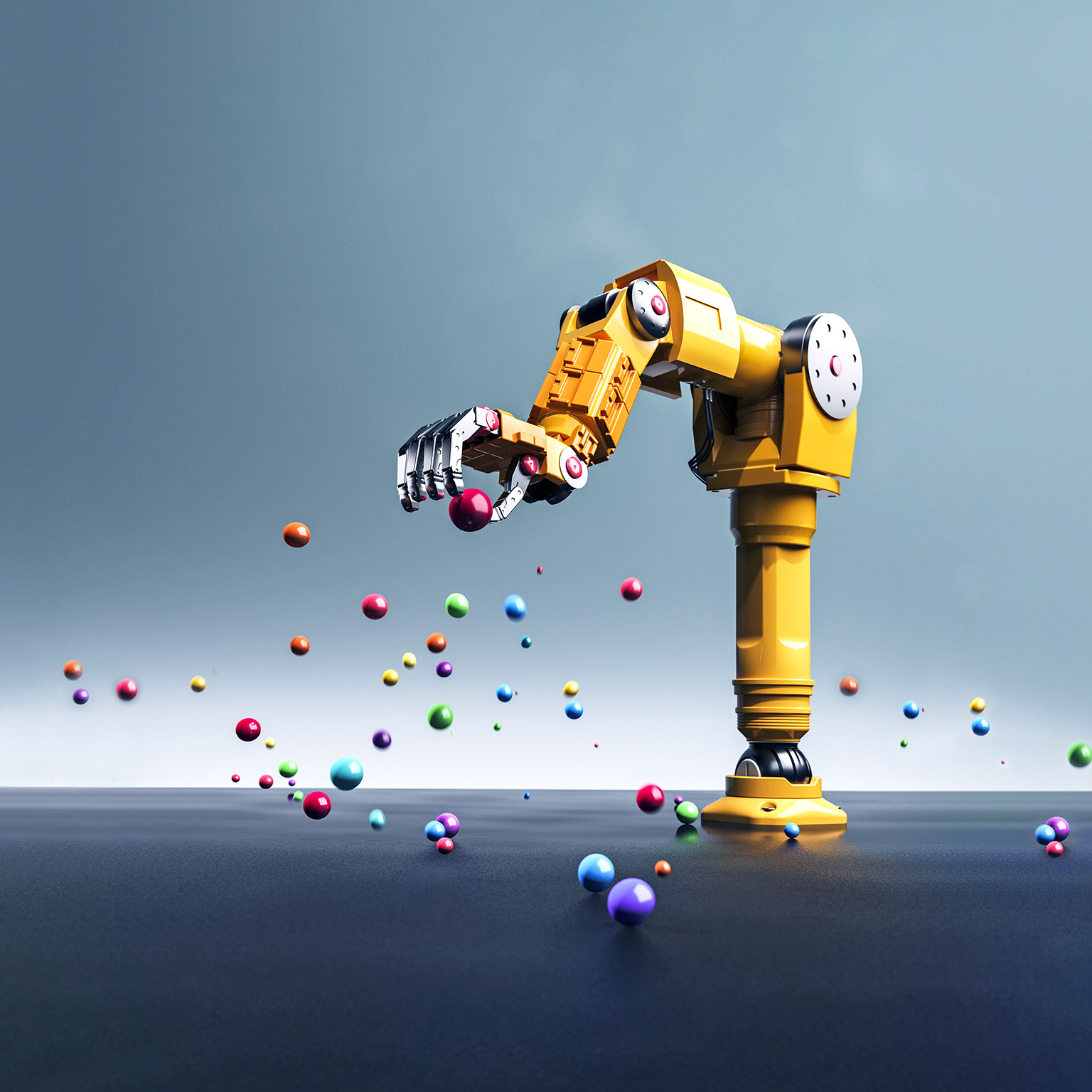 A conceptual image of a yellow robot arm grabbing a red ball surrounded by other colored bouncing balls.