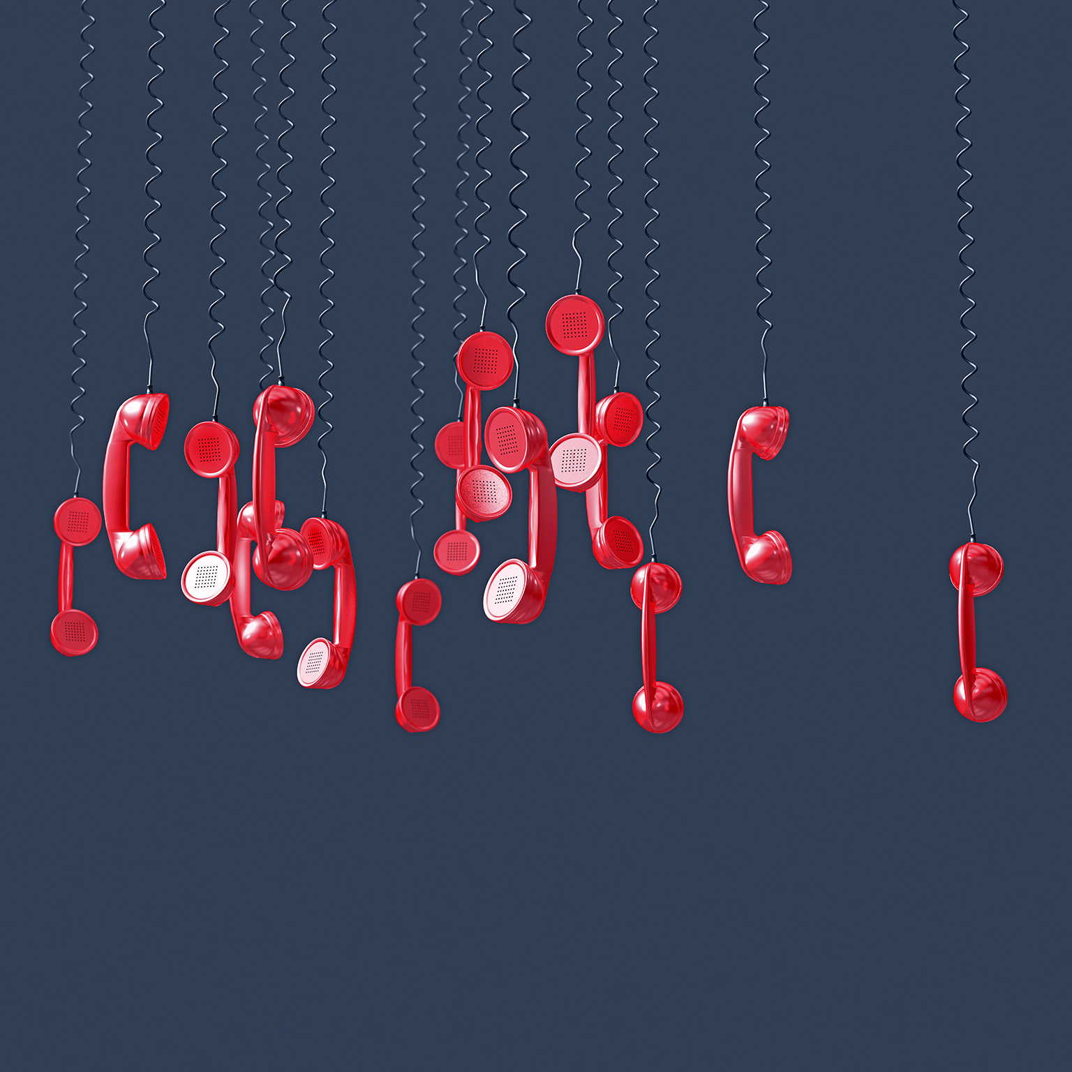 Image of numerous red phones hanging upside down by their cords.