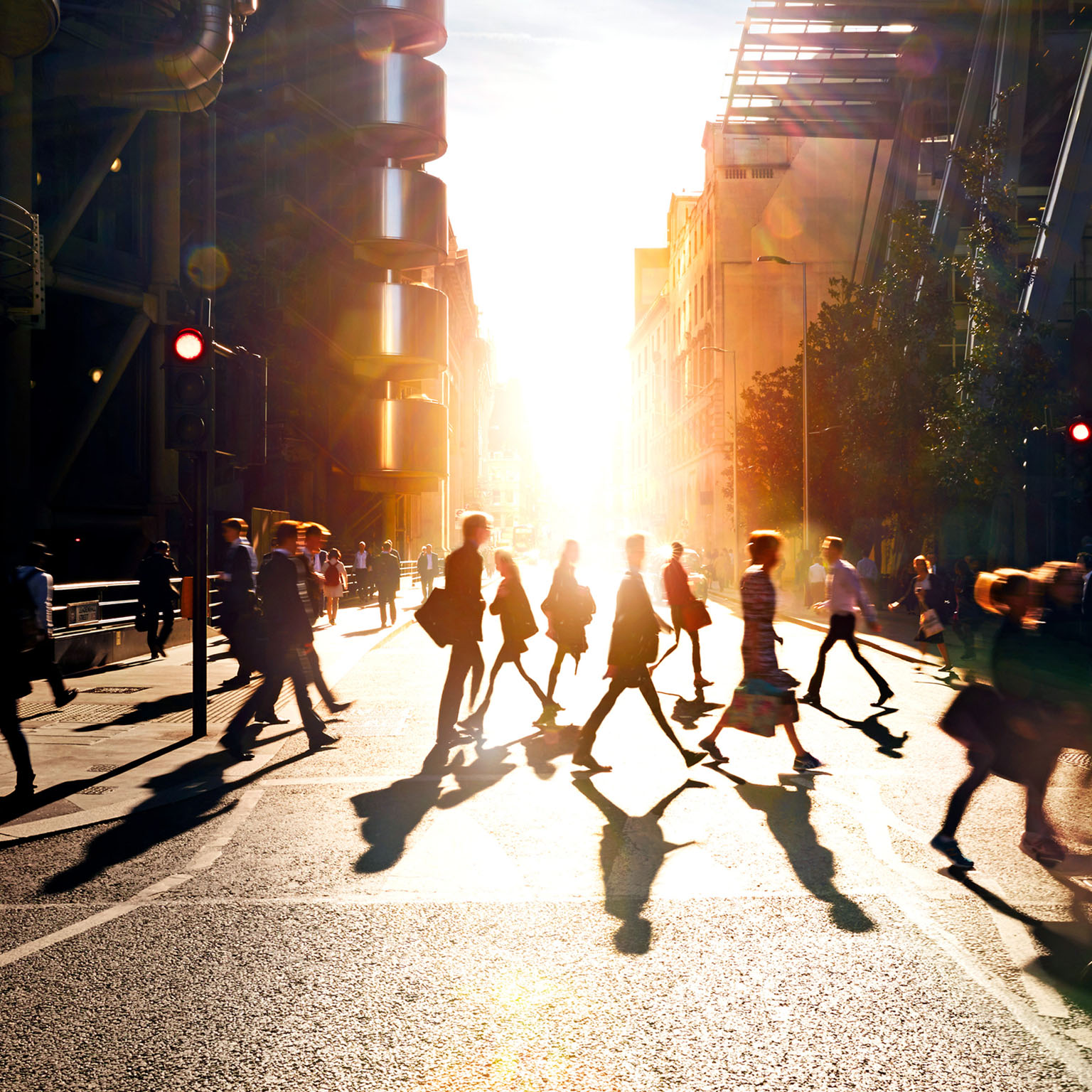 Business people walking through at city at dawn