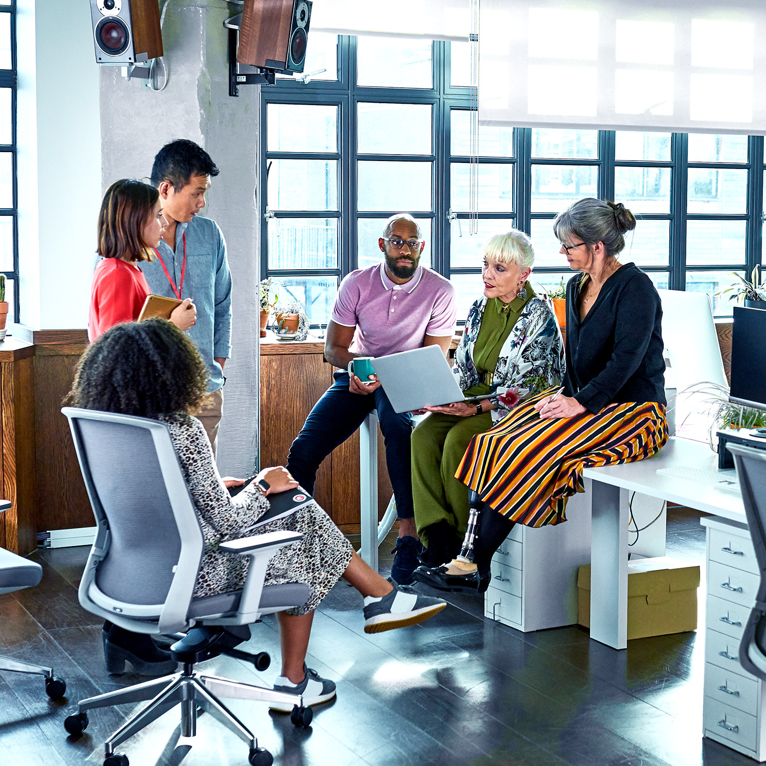 Diverse group of business colleagues having informal meeting