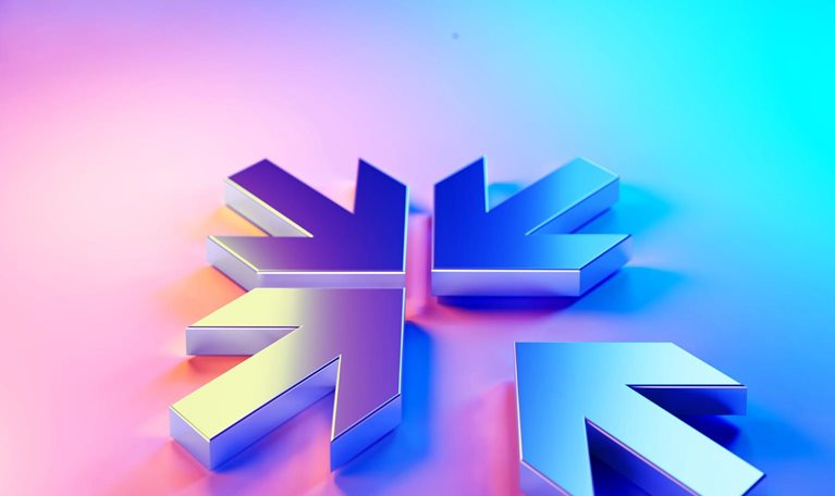 Four metallic arrows, pointing inward, creating a snowflake like shape. The arrows are rendered in a gradient of purple and blue, giving a modern, almost holographic effect.