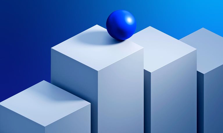An image of a sphere balanced on top of a stack of rising blocks.