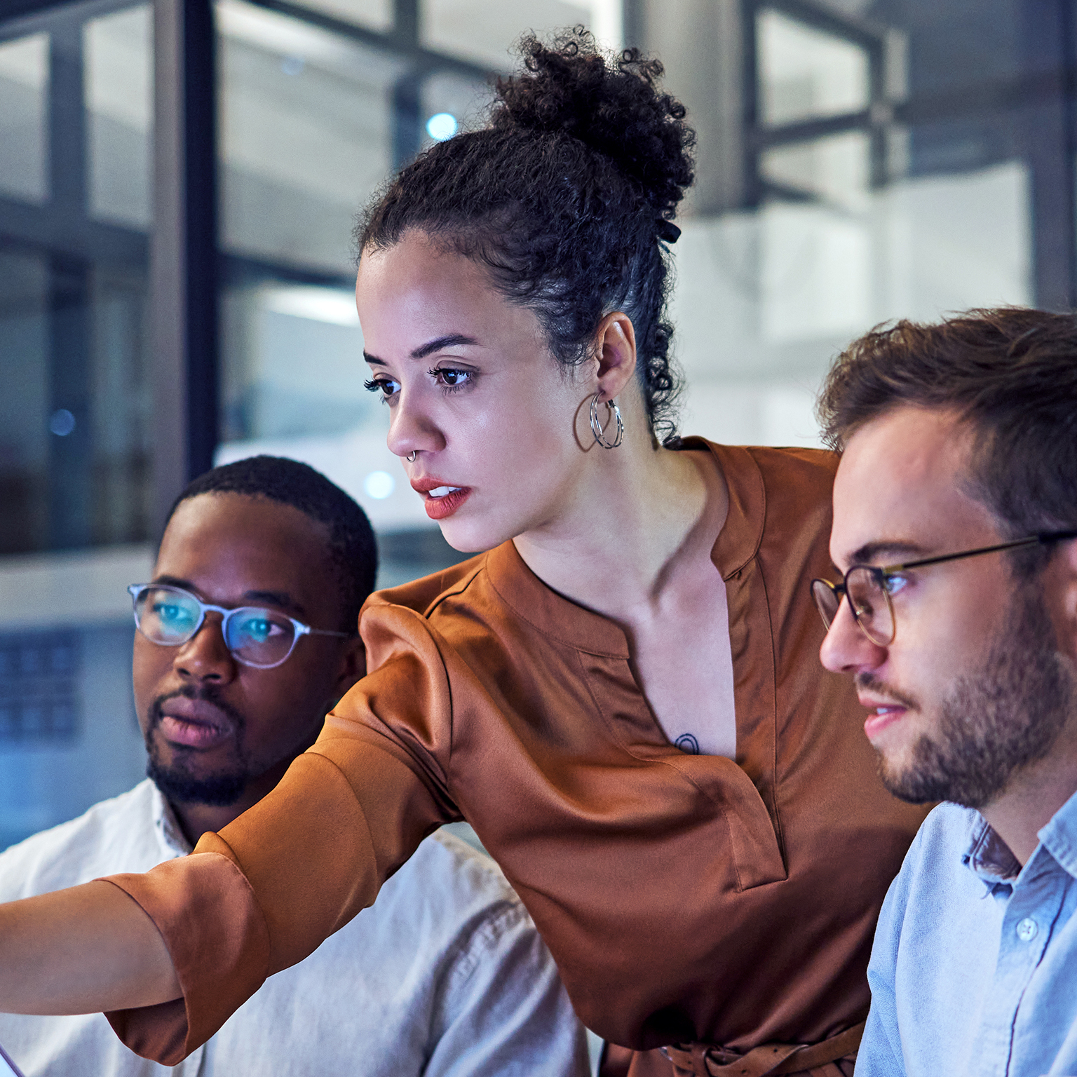 Shot of two young businesspeople looking stressed while working on a computer in the office.