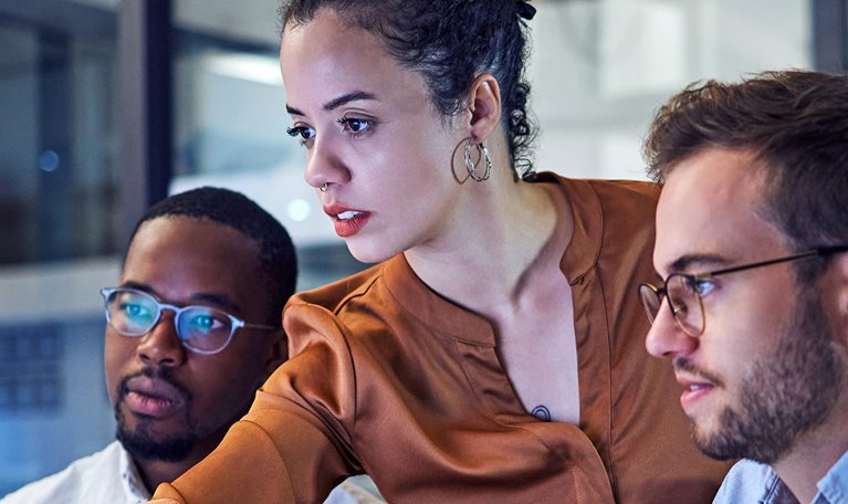 Shot of two young businesspeople looking stressed while working on a computer in the office.