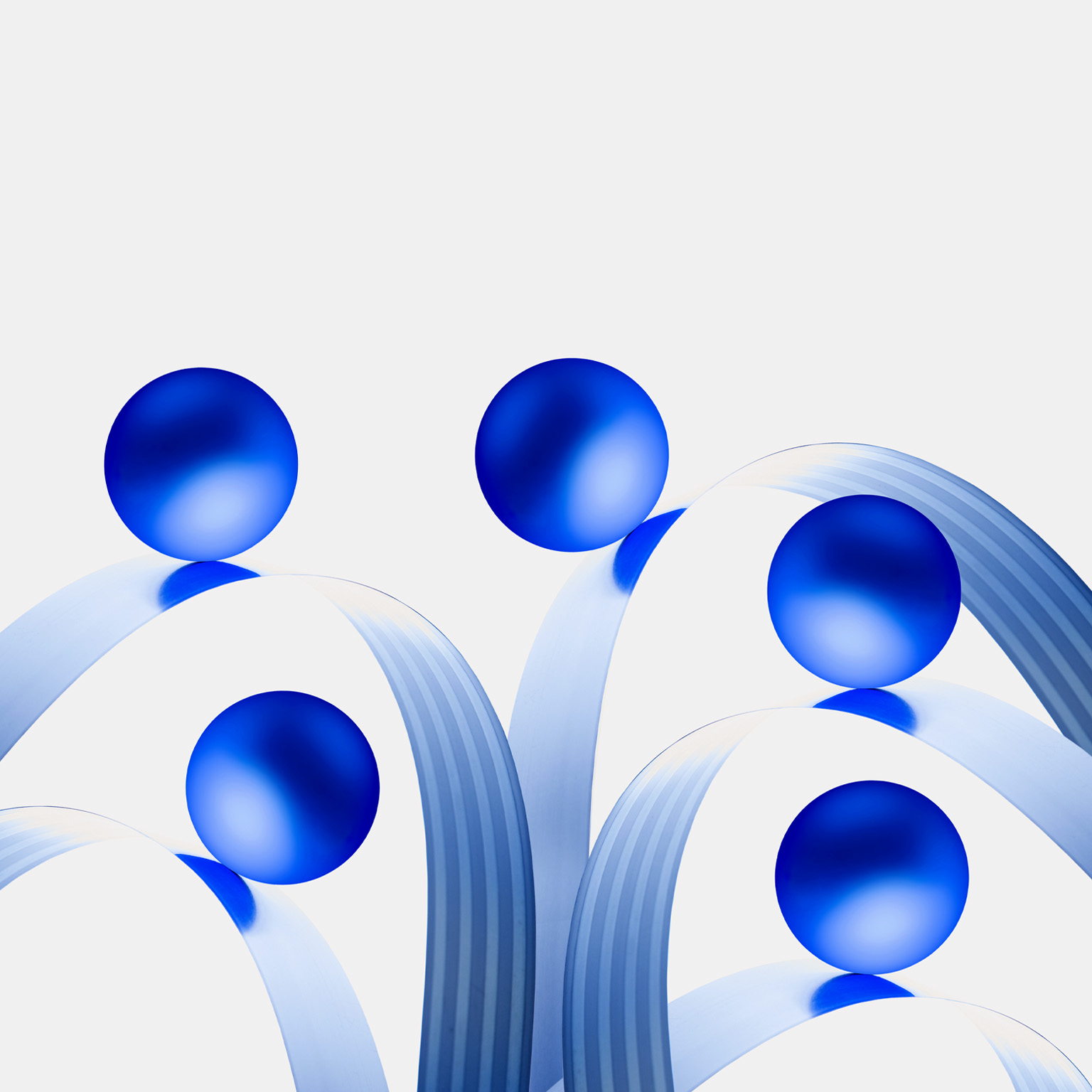 Five blue balls, each held up by metal bands that curve in a wavy pattern.