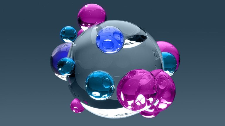 A cluster of glossy, translucent spheres in blue, purple, and clear tones surrounds a larger central orb.
