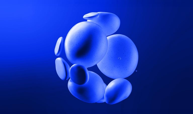 A cluster of smooth, blue, rock-like shapes seemingly floating against a deep blue background. The shapes vary slightly in size and are clustered together, creating a visually interesting, abstract form.