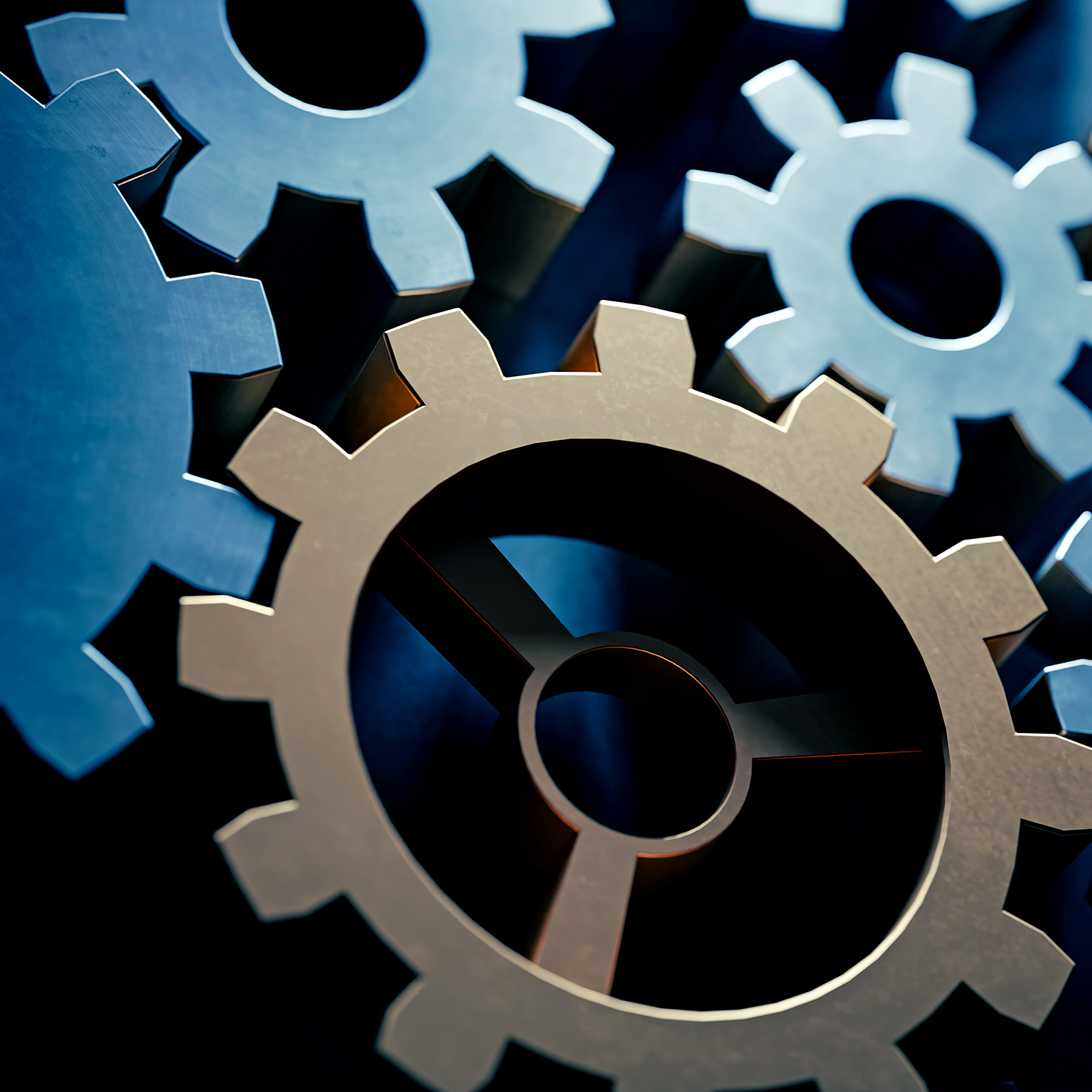 Shadowed image of blue and gold gears moving in a machine