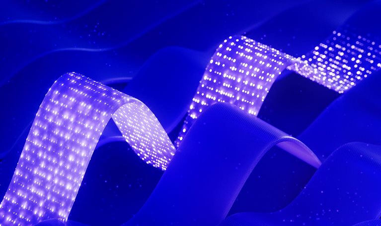 Abstract blue waves with two glowing dotted ribbons creating a futuristic, digital effect.