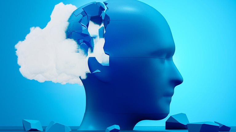 An abstract blue human head cracking open as a cloud spills out, symbolizing the mental fragmentation and strain of cognitive overload.
