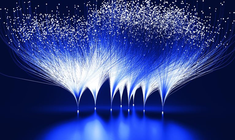 Abstract blue and white lines emanating from white dots against a dark blue background. This visual metaphor represents the branching-out and expansive growth facilitated by innovation.