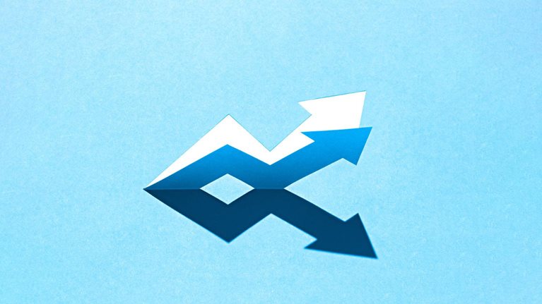 The image shows a pair of contrasting arrows forming a zig-zag pattern on a light blue background. The arrows are made of paper, with one set appearing white and creating a shadow that forms a darker, mirrored reflection.