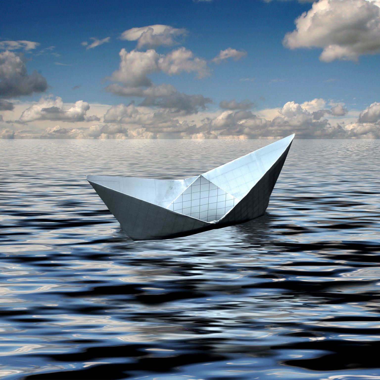A small boat crafted from graph paper floats gracefully in the ocean, poised for an epic voyage.