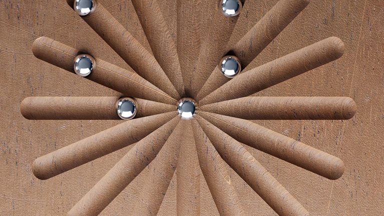 3D render of metal balls roll along wooden pattern.