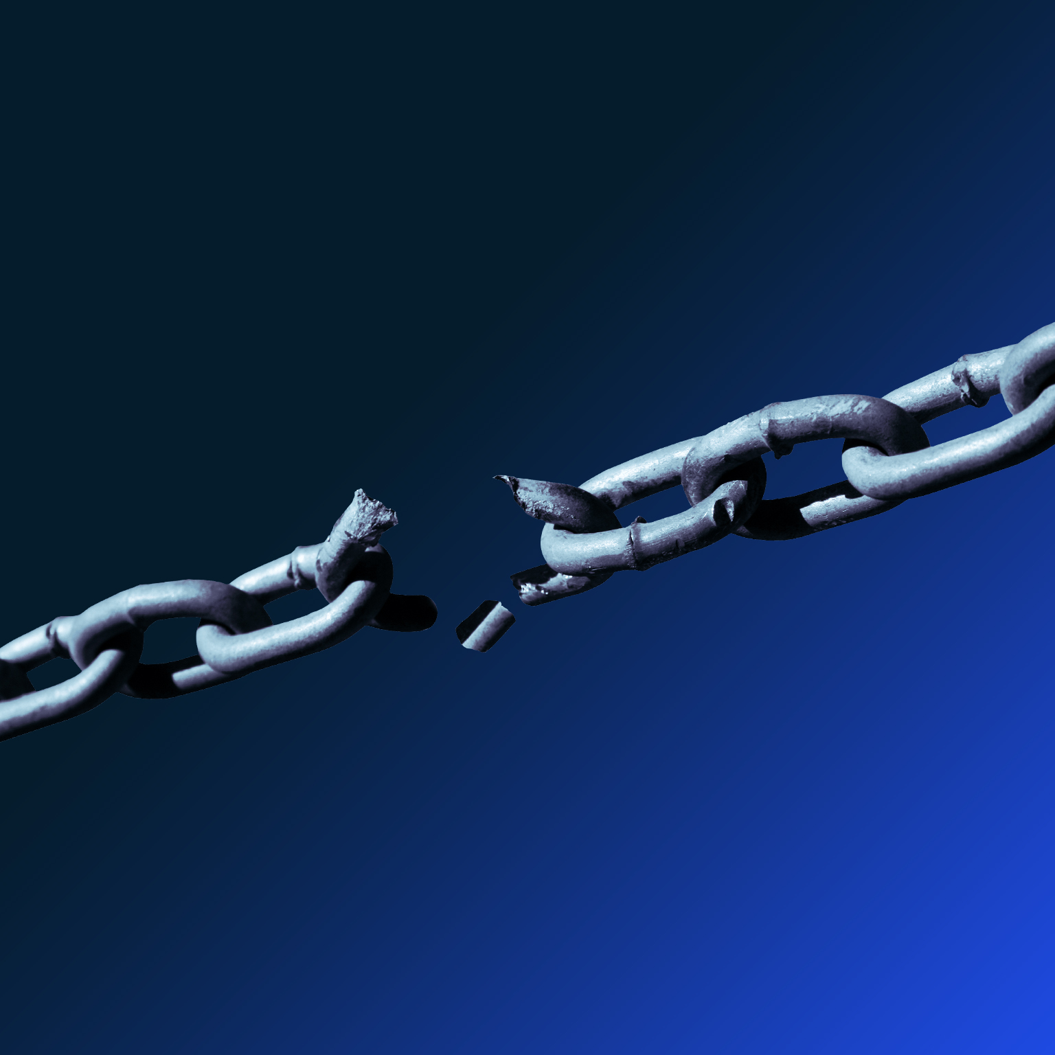 Close-up of metallic chain breaking