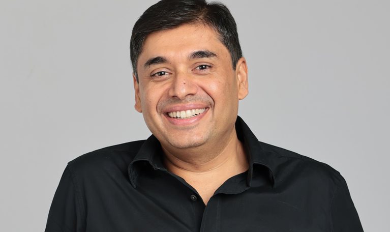 Smiling portrait of Naveen Tewari
