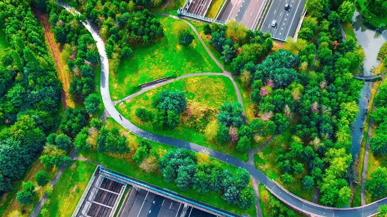 Photo of overview shot of a park with a highway
