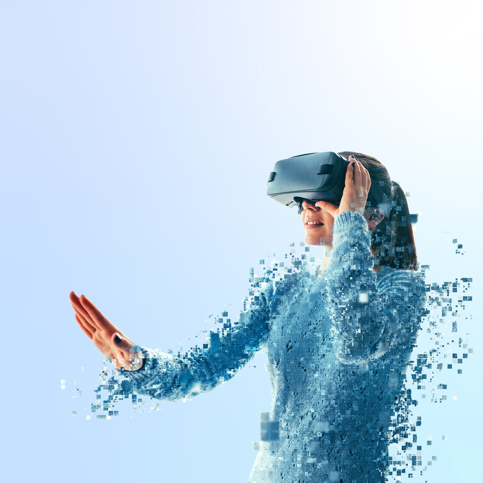 A woman disintegrating while looking into a virtual reality headset