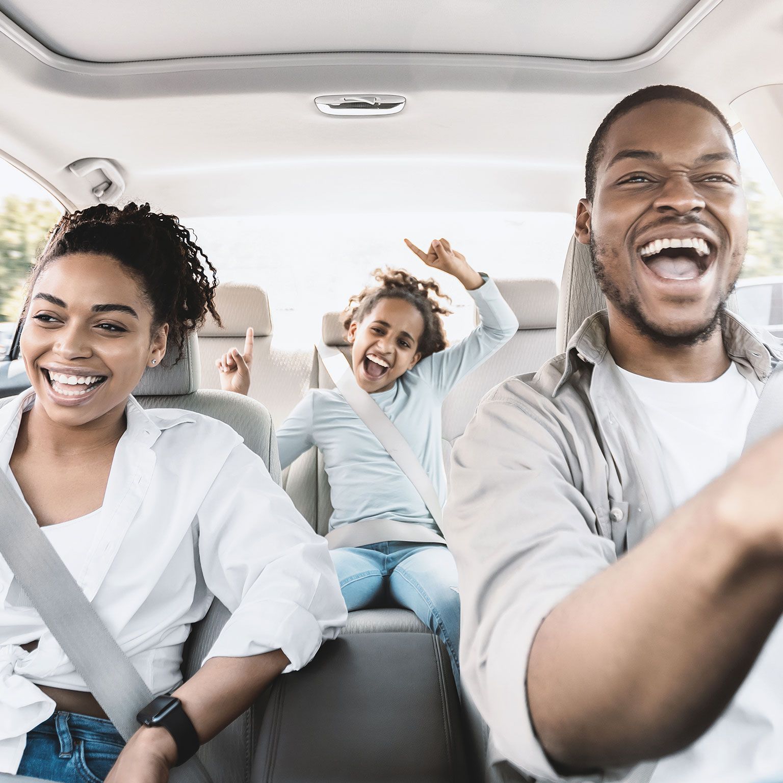 Happy Black Family Of Three Singing Having Fun Riding Car