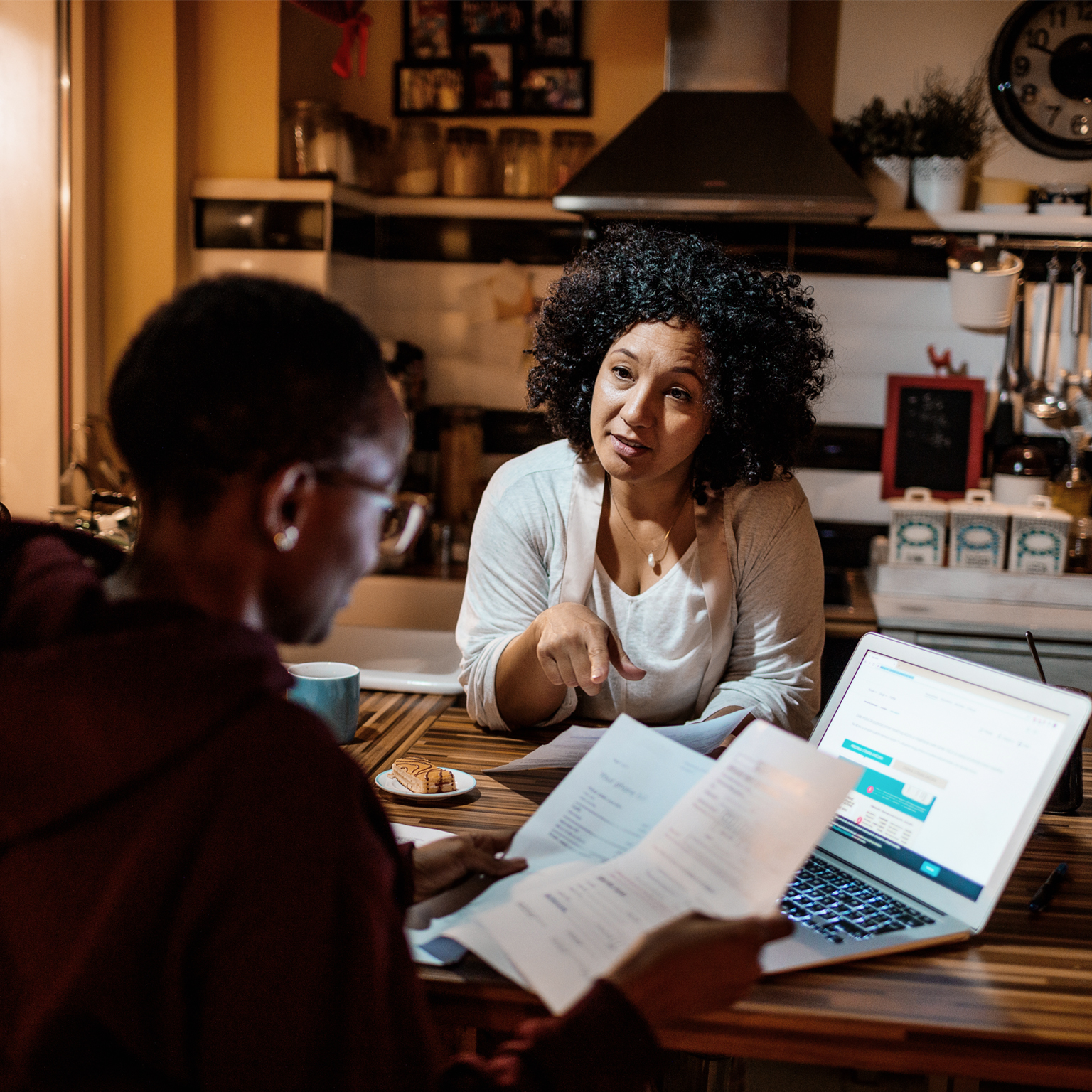 Mother and daughter dealing with home finances