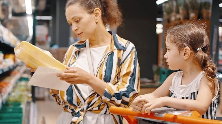photo oh mom at grocery store with child sitting in shopping cart