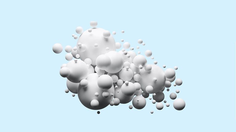 Group of white spheres on light blue background
