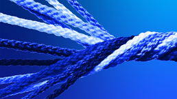 A close up of a blue and white strands of ropes knotting together into one