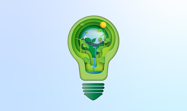 Paper cutout of light bulb with natural environment, waterfall, sunflower, and wind turbine inside it.